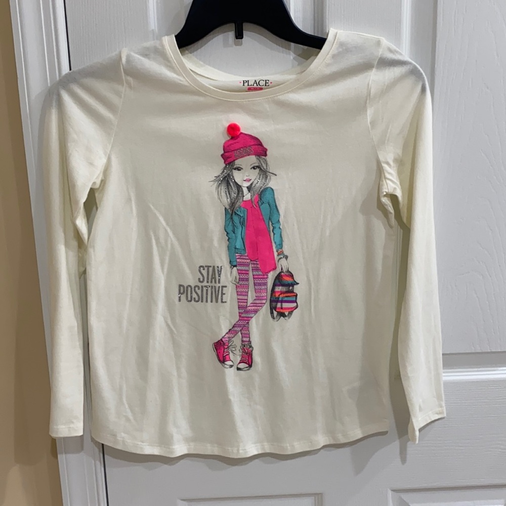 Children’s Place shirt. Size 14 because it’s XL.